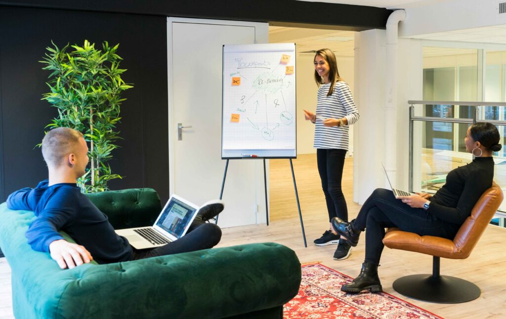 A photo of a presentation where a team explains findings from data research.