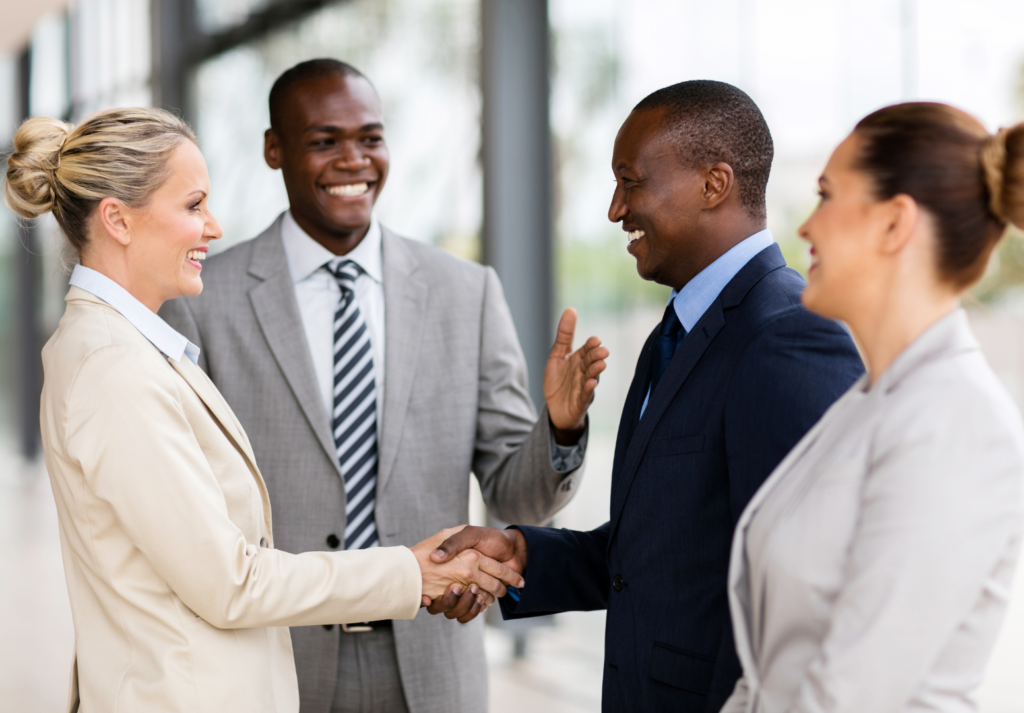 Handshake symbolizes partnerships formed after careful decision marketing evaluations.